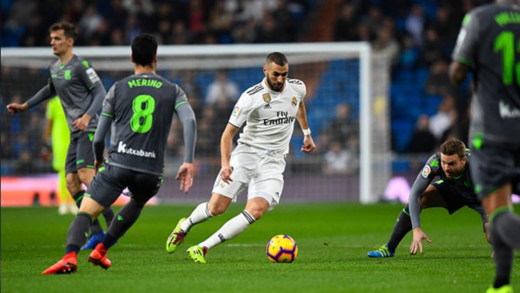 Karim Benzema di kawal ketat pemain lawan Copyright: © Getty Images