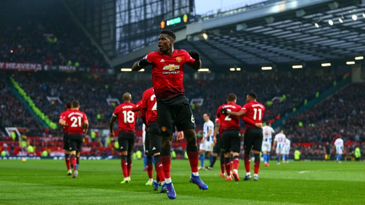 Selebrasi Paul Pogba usai bobol gawang Brighton. Copyright: © Getty Images