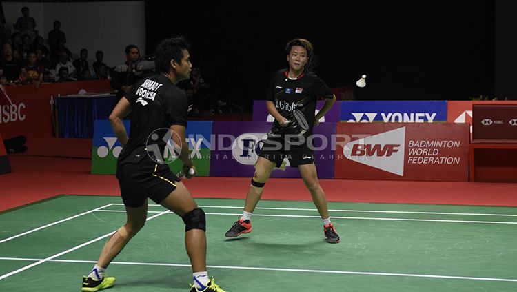 Meski sudah umumkan pensiun, Tontowi Ahmad mengaku masih ingin bermain dengan partner terbaiknya, Liliyana Natsir. Copyright: © INDOSPORT/Herry Ibrahim