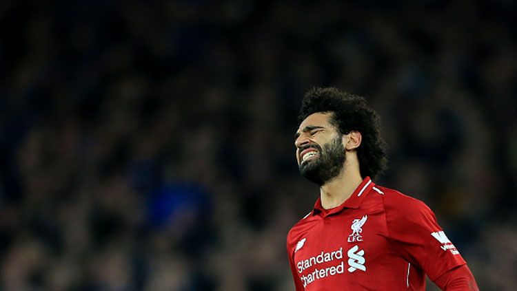 Ekspresi rasa kecewa dari pemain bintang Liverpool, Mohamed Salah. Copyright: © INDOSPORT