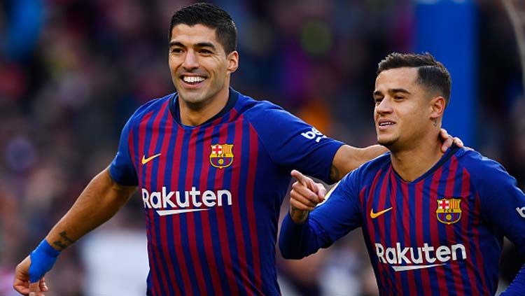 Luis Suarez (kiri) dan Pihilippe Coutinho yang kini bermain di Barcelona sama-sama pernah membela Liverpool. Gabriel Bouys/Getty Images. Copyright: © GABRIEL BOUYS/GETTYIMAGES