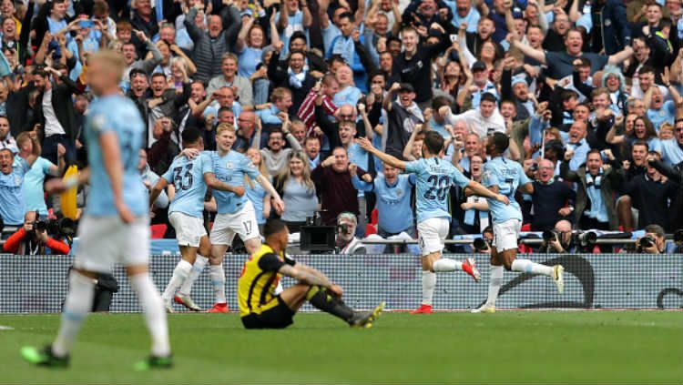 Selebrasi para pemain Manchester City. Copyright: © Richard Heathcote/Getty Images