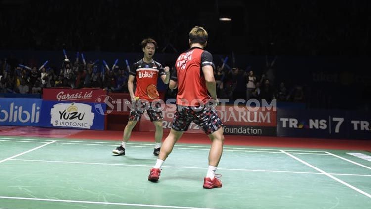 Kevin Sanjaya/Marcus Gideon merayakan keberhasilan mereka mengalahkan Liu Yuchen/Li Junhui dalam semifinal Indonesia Open 2019. Copyright: © Herry Ibrahim/INDOSPORT