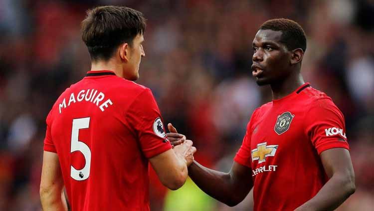 Dua pemain sepak bola di Manchester United, Marcus Rashford dan Harry Maguire, membela Paul Pogba yang mendapat perlakuan rasis di media sosial. Copyright: © premierleague