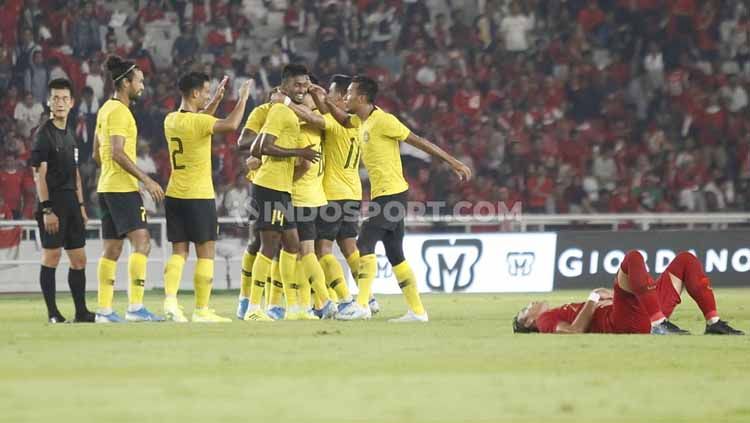 Para pemain Timnas Malaysia merayakan kemenangan atas Timnas Indonesia, Kamis (05/09/2019). Copyright: © Herry Ibrahim/INDOSPORT