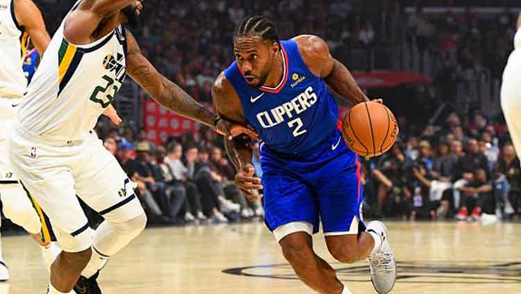 Bintang LA Clippers, Kawhi Leonard (kanan) menjadi bintang kemenangan timnya saat melawan Utah Jazz di musim reguler NBA 2019-2020 Copyright: © Icon Sportswire/GettyImages