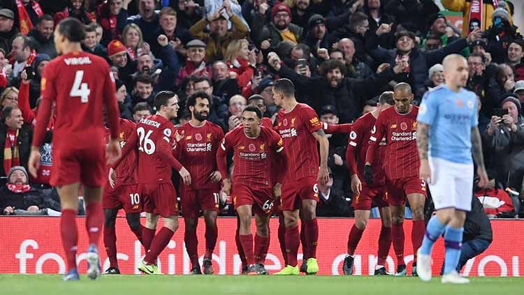 Liverpool berpeluang tipis untuk bisa sabet juara menyusul setelah penghentian Eredivisie Belanda karena virus Corona. Copyright: © Laurence Griffiths/Getty Images