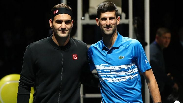 Roger Federer dan Novak Djokovic di Nitto ATP Finals 2019. Copyright: © Julian Finney/Getty Images