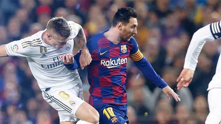 Dua raksasa sepak bola, Barcelona dan Real Madrid, berencana menggelar duel abadi mereka, El Clasico, di luar Spanyol. Copyright: © Ofisial Barcelona