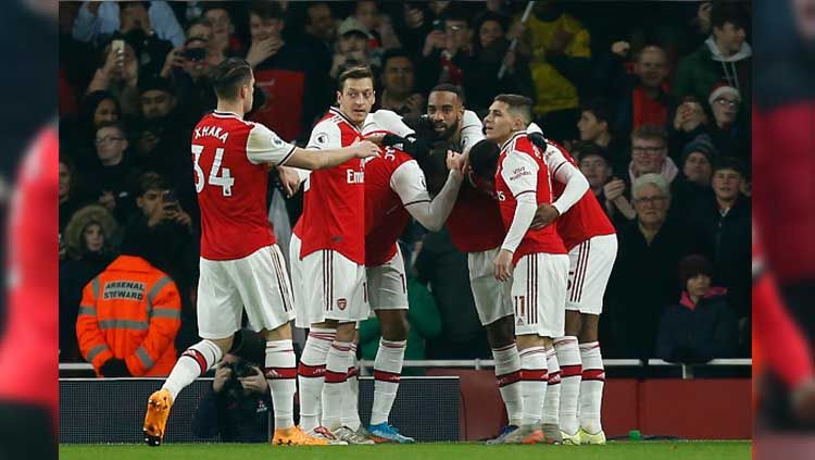 Selebrasi pemain Arsenal usai Nicolas Pepe mencetak gol. Copyright: © IAN KINGTON/IKIMAGES/AFP via Getty Images