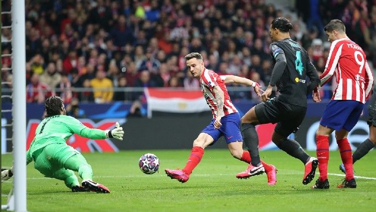 Saul Niguez saat mencetak gol di pertandingan babak 16 besar Liga Champions antara Atletico Madrid vs Liverpool. Copyright: © Atletico Madrid