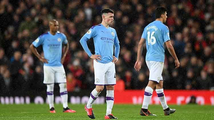 Manchester City percaya jika larangan sanksi berlaga di Liga Champions yang mereka terima tidak akan membuat para pemain mereka melakukan eksodus masal. Copyright: © Michael Regan/Getty Images