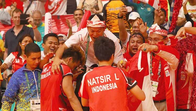 Peraih medali emas pertandingan Medali Emas Ganda Campuran Tontowi Ahmad dan Liliyana Natsir saat disambut suporter Indonesia, pada Olimpiade Rio 2016 di Rio de Janeiro, Brasil. Copyright: © Dean Mouhtaropoulos/Getty Images