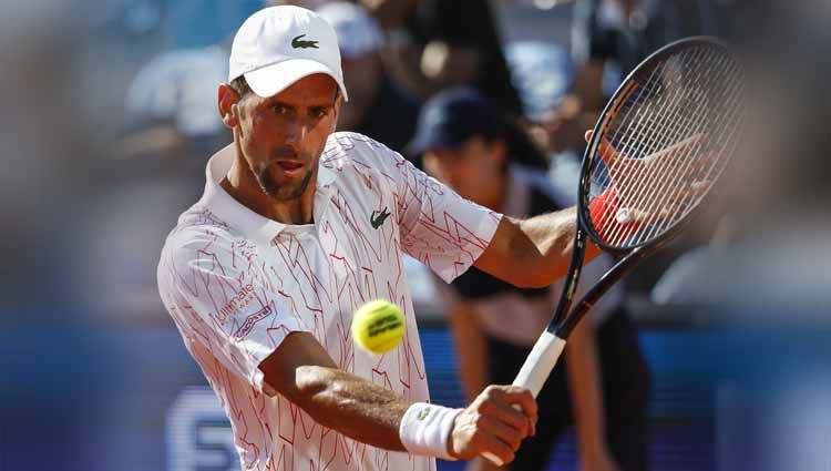 Petenis peringkat 1 dunia asal Serbia, Novak Djokovic positif terkena virus Corona setelah terlibat dalam turnamen Adria Tour yang digelar di Serbia dan Krosia. Copyright: © Srdjan Stevanovic/Getty Images