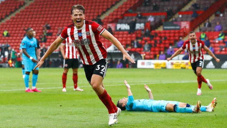 Selebrasi gol Sander Berge di laga pekan ke-32 Liga Inggris antara Sheffield United vs Tottenham Hotspur. Copyright: © Jason Cairnduff/Pool via Getty Images