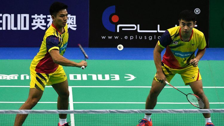 Demi terpilih dalam skuat di tim bulutangkis putra Malaysia yang akan berlaga di Piala Thomas 2020, pasangan Goh Sze Fei/Nur Izzuddin siap halalkan segala cara. Copyright: © Robertus Pudyanto/Getty Images