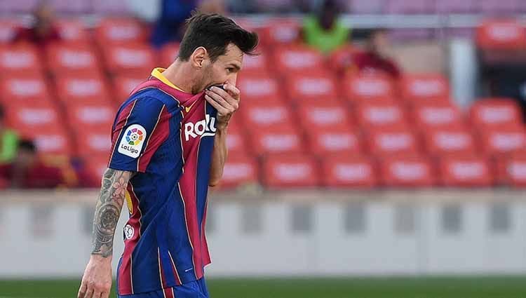 Lionel Messi masih kokoh di daftar puncak top skor sementara LaLiga Spanyol 2020/21 ini meskipun mencetak nol gol dalam laga Osasuna vs Barcelona. Copyright: © LLUIS GENE/AFP via Getty Images
