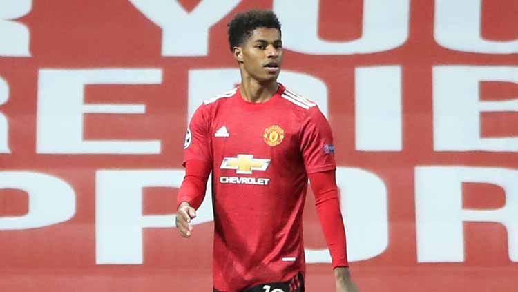 Bintang Manchester United, Marcus Rashford, mendapatkan pujian selangit dari mantan Presiden Amerika Serikat, Barack Obama, atas aksi mulia yang ia lakukan. Copyright: © Getty Images