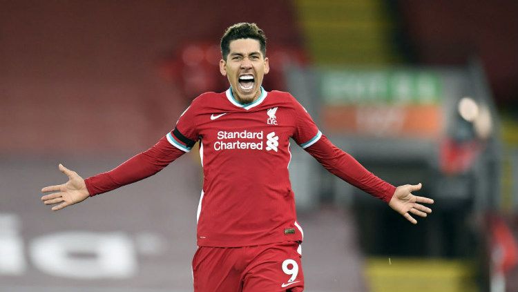 Liverpool berhasil mengalahkan Tottenham Hotspur dengan skor 2-1 di Stadion Anfield, Kamis (17/12/20) dini hari WIB. Roberto Firmino menjadi pahlawan The Reds berkat golnya di penghujung laga. Copyright: © Peter Powell/PA Images via Getty Images