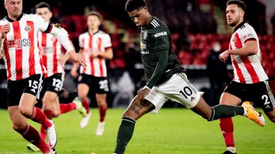 Aksi Marcus Rashford di laga Liga Inggris Sheffield United vs Manchester United. Copyright: © Ash Donelon/Manchester United via Getty Images