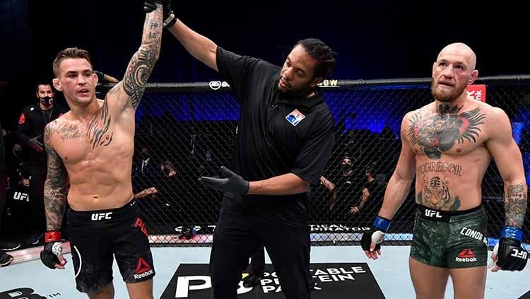 Kemenangan dustin poirier atas conor mcgregor di UFC 257. Copyright: © Jeff Bottari/Zuffa LLC/Getty Images