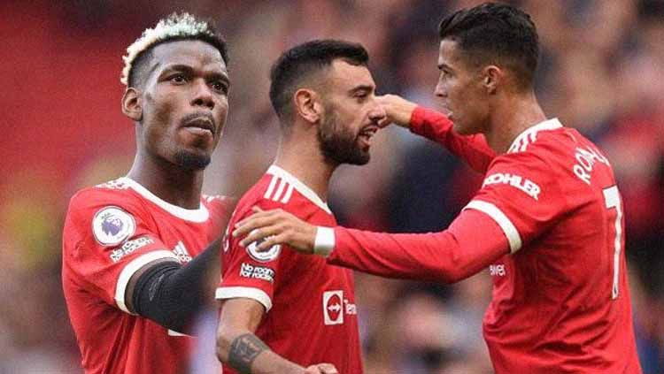 3 pemain andalan Manchester United, Paul Pogba, Bruno Fernandes, dan Cristiano Ronaldo Copyright: © OLI SCARFF / AFP