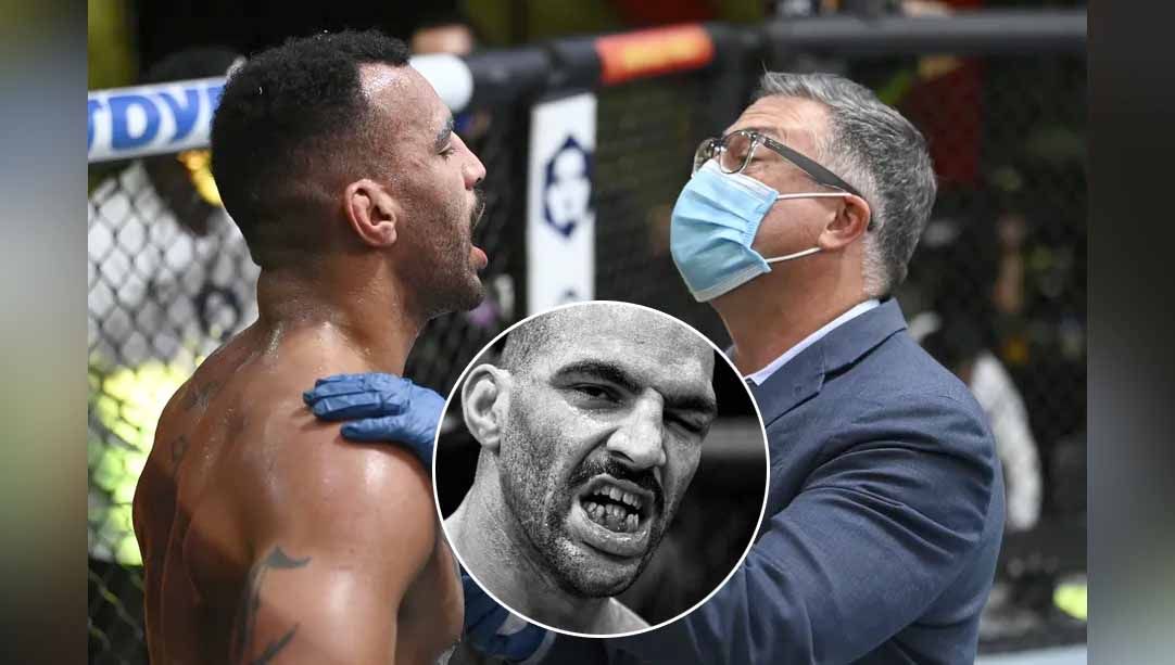 Petarung UFC Devin Clark diperiksa oleh dokter cedera pada gigi saat melawan Ion Cutelaba di UFC Vegas 37. Copyright: © mmamania/Jeff Bottari/Zuffa LLC
