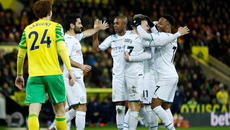 Skuat Man City merayakan gol Phil Foden ke gawang Norwich (13/02/22). (Foto: Reuters/John Sibley) Copyright: © Reuters/John Sibley