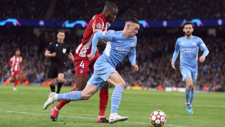 Aksi Phil Foden di laga Manchester City vs Atletico Madrid pada leg pertama perempatfinal Liga Champions, Rabu (06/04/22) dini hari WIB. Foto: Reuters/Lee Smith Copyright: © Reuters/Lee Smith