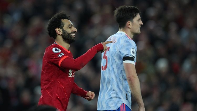 Mohamed Salah dan Harry Maguire di laga Liverpool vs Manchester United (REUTERS/Phil Noble) Copyright: © REUTERS/Phil Noble