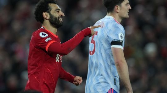 Mohamed Salah dan Harry Maguire di laga Liverpool vs Manchester United (REUTERS/Phil Noble) Copyright: © REUTERS/Phil Noble