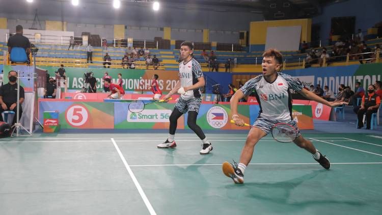Hasil Badminton Asia Championships 2022 antara ganda putra Indonesia, Fajar Alfian/Muhammad Rian Ardianto, melawan wakil China, Liu Yu Chen/Ou Xuan Yi. Copyright: © PBSI