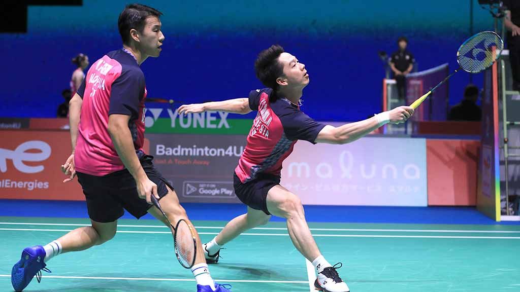 Pasangan ganda putra Indonesia, Marcus Gideon/Kevin Sanjaya di Kejuaraan Dunia Bulutangkis 2022. Foto: PBSI Copyright: © PBSI