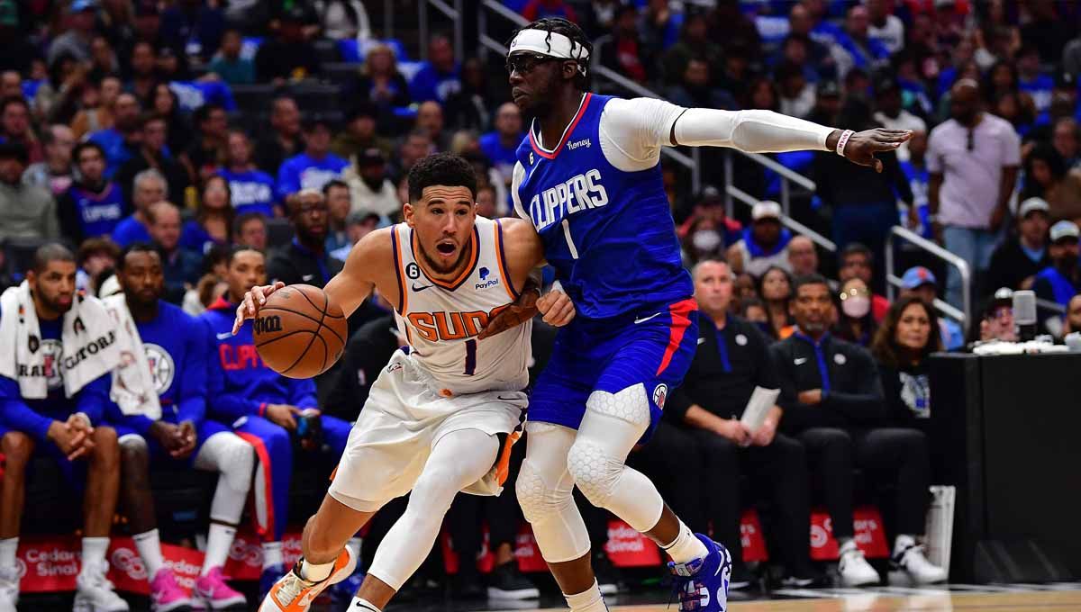 Pertandingan basket NBA antara Phoenix Suns vs Golden State Warriors. Foto: REUTERS/Gary A. Vasquez. Copyright: © REUTERS/Gary A. Vasquez
