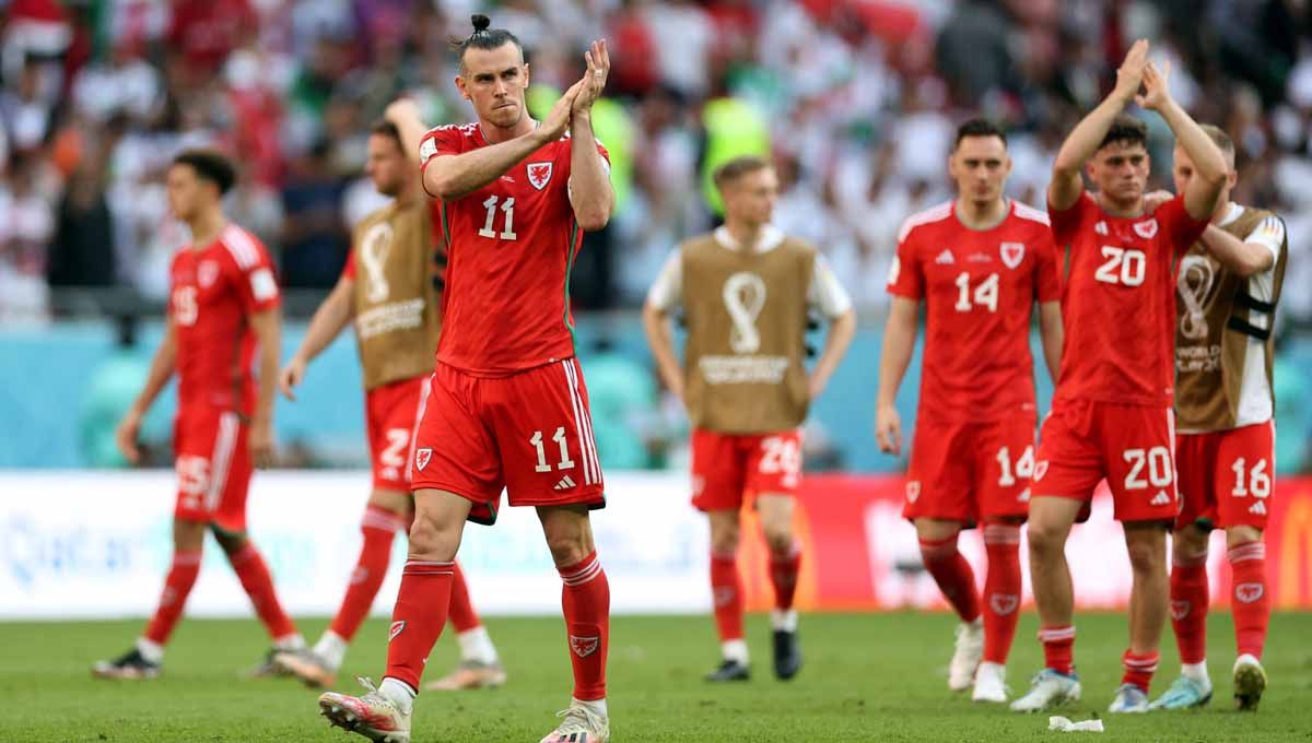 Reaksi Gareth Bale dengan teman setimnya usai dikalahkan Iran di grup B Piala Dunia Qatar 2022. (Foto: REUTERS/Carl Recine) Copyright: © REUTERS/Carl Recine