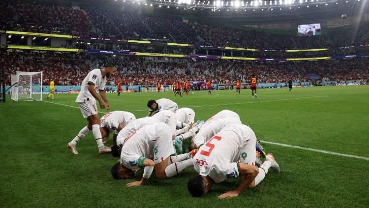 Selebrasi para pemain Maroko usai menjebol gawang Belgia di laga grup F Piala Dunia 2022 (27/11/22). (Foto: REUTERS/Amr Abdallah Dalsh) Copyright: © REUTERS/Amr Abdallah Dalsh