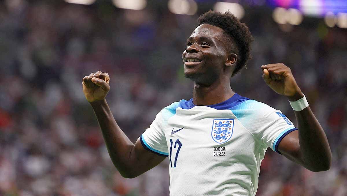 Bukayo Saka pemain Inggris merayakan gol ketiga mereka di Piala Dunia Qatar 2022. (Foto: REUTERS/Kai Pfaffenbach) Copyright: © REUTERS/Kai Pfaffenbach