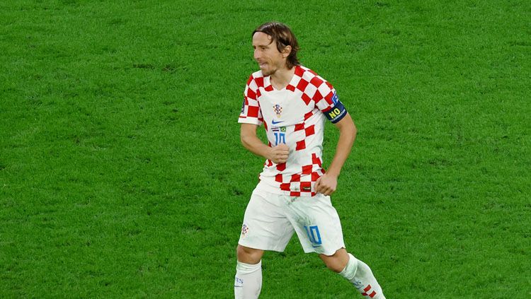 Ekspresi kapten Timnas Kroasia, Luka Modric usai menang atas Brasil di babak perempatfinal Piala Dunia 2022 (Foto: REUTERS/Lee Smith). Copyright: © REUTERS/Lee Smith