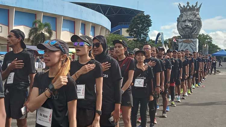 Komunitas Playon Malang (KPM) turut berpartisipasi dalam memperingati 100 hari terjadinya Tragedi Kanjuruhan pada Minggu (08/01/23). Copyright: © Ian Setiawan/INDOSPORT