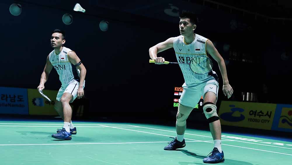 Ada tiga pebulutangkis yang perang dingin di lapangan selain Pramudya Kusumawardana/Yeremia Rambitan, di mana salah satunya Kevin Sanjaya/Marcus Gideon. Copyright: © PBSI