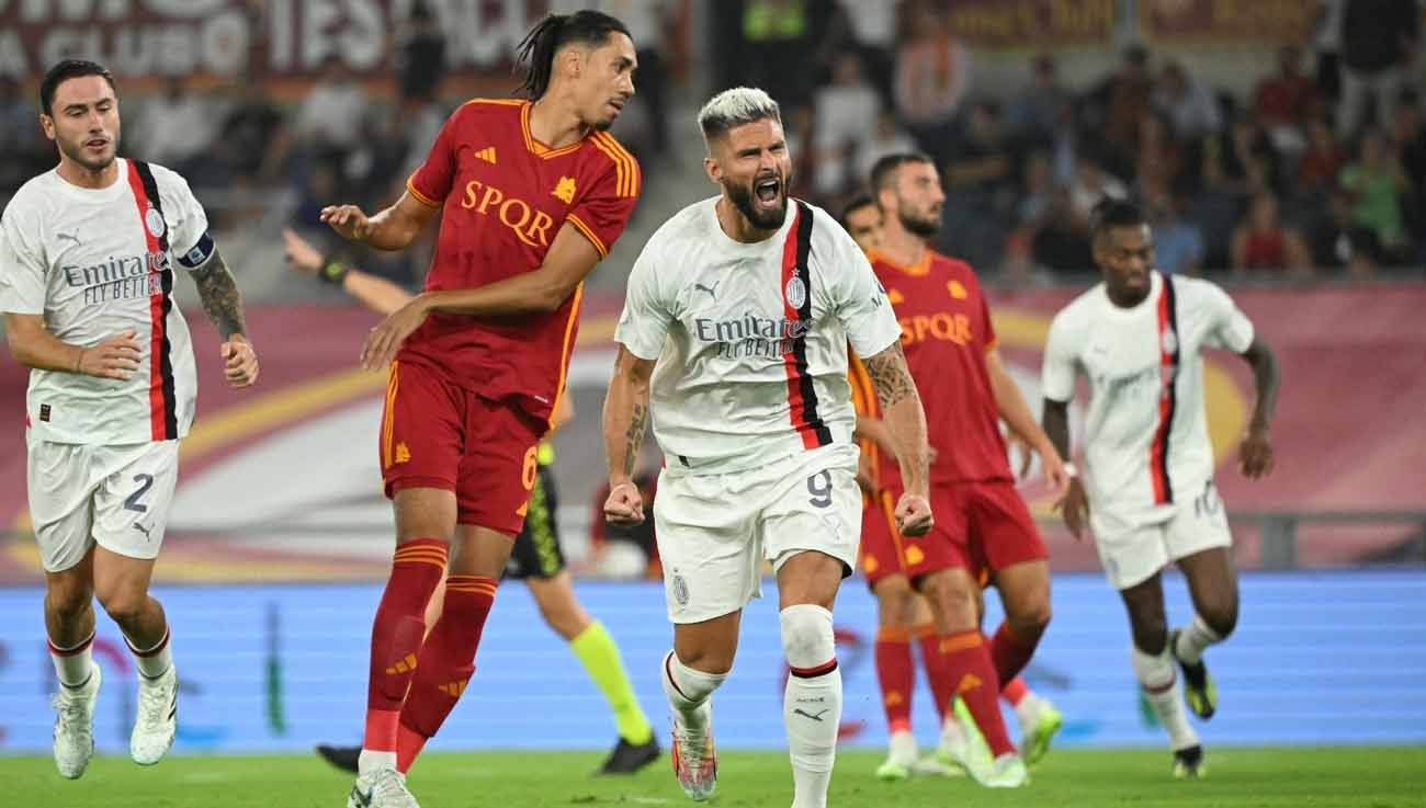 Selebrasi pemain AC Milan, Olivier Giroud usai mencetak gol pertama saat melawan AS Roma pada laga Liga Italia. (Foto: REUTERS/Alberto Lingria) Copyright: © REUTERS/Alberto Lingria