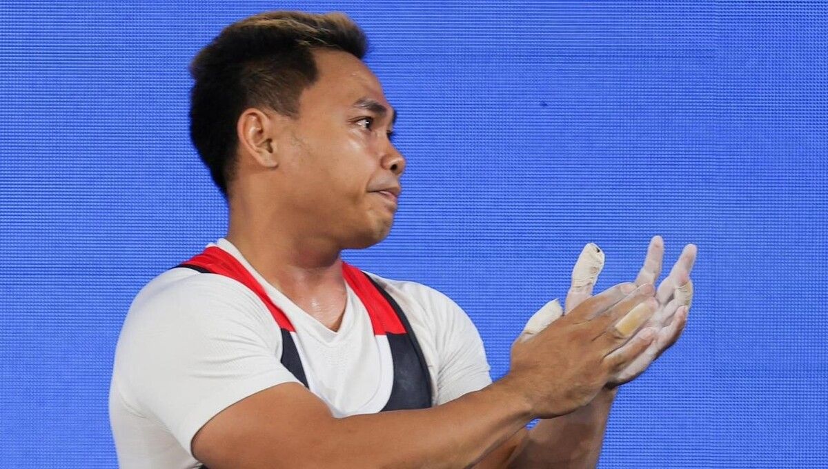 Ekspresi Eko Yuli Irawan saat gagal meraih medali di Asian Games 2022 (Foto: NOC Indonesia/Naif Al'as) Copyright: © NOC Indonesia/Naif Al'as