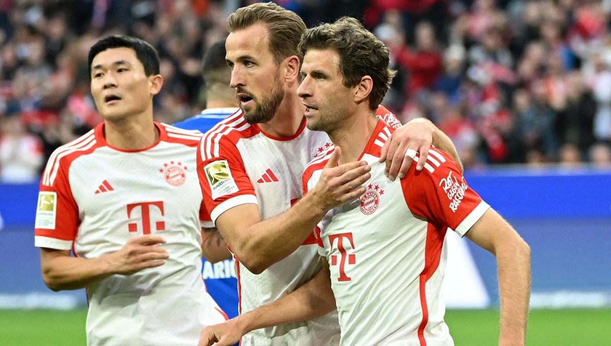 Kim Min-jae, Harry Kane, dan Thomas Muller merayakan gol di laga Bayern Munchen vs Darmstadt. (Foto: REUTERS/Angelika Warmuth) Copyright: © REUTERS/Angelika Warmuth