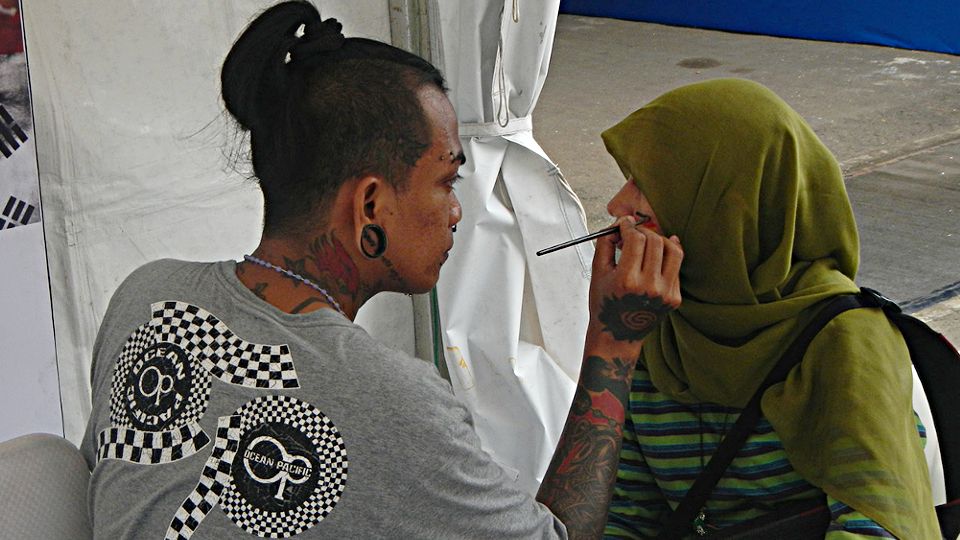 Gerai lukis wajah (face painting) di arena Indonesia Open 2014 di Istora Senayan, Jakarta, Selasa (17/06/14). Copyright: &copy; Ratno Prasetyo/INDOSPORT